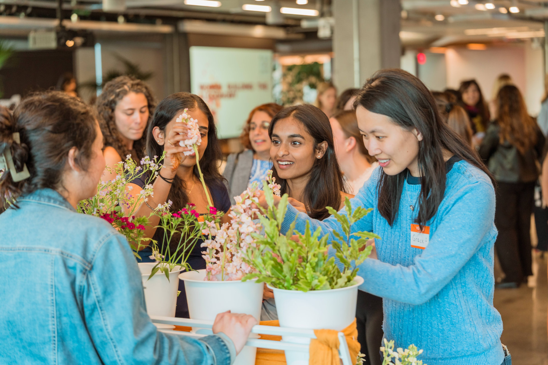 Members at a Women in AI flower workshop